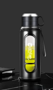 Detail view of large capacity glass water bottle with tea infuser and side handle strap