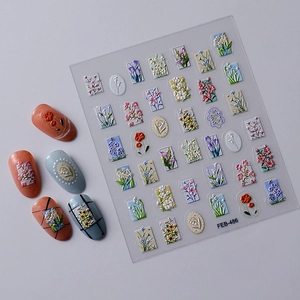 Detailed view of 5D floral nail art stickers with textured tulip and daisy patterns