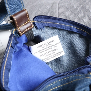 Close-up of internal fabric label showing 100% cotton material and stitching detail