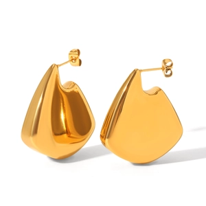 Macro detail of 18K gold plated irregular geometric earrings on a white background
