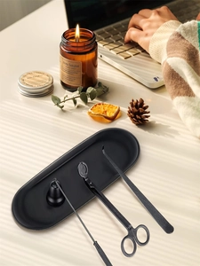 Black candle accessory set with snuffer, trimmer, dipper and tray for home decor.