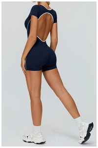 Deep blue fitness bodysuit featuring an open back design with white contrast piping details