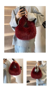 Close-up of wine red faux fur handbag featuring soft texture and circular handle