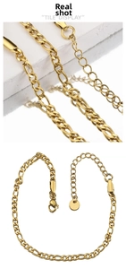 Detail of 18k gold plated Figaro chain link with secure lobster clasp and extender