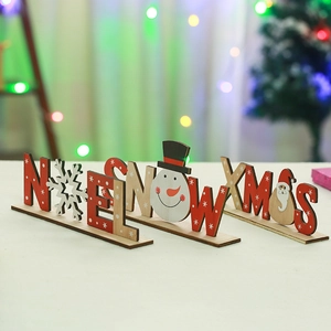 Three-piece wooden Christmas table signs featuring Noel, Snow, and Xmas with festive motifs