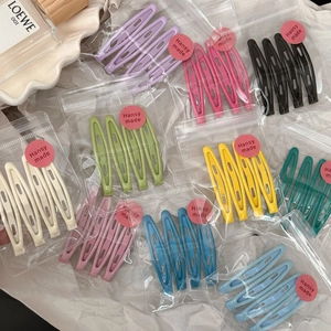 Set of 4 candy-colored metal hair clips in various matte finishes and teardrop designs
