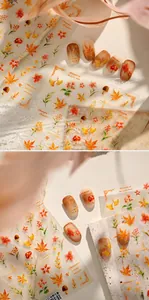 Detail of autumn watercolor nail stickers with maple leaves and vintage mushroom designs