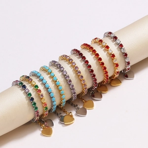 Detailed view of colorful heart-shaped crystal charms on gold and silver chains