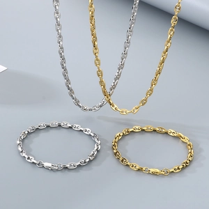 Matching set of gold and silver stainless steel pig nose link necklaces and bracelets