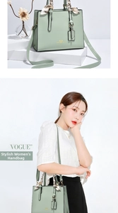 Detail of light green PU leather tote bag with silk scarf and heart print design