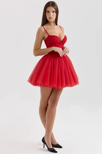 Close-up of red mesh patchwork mini dress showing layered tulle and strap details