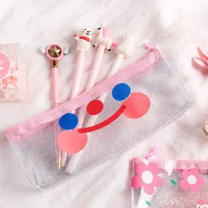 Pink glitter transparent pencil case with smiley face on a soft white background