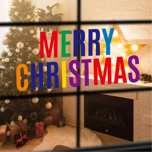 Cozy indoor scene with Christmas tree and festive Merry Christmas lettering decoration