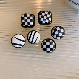 Minimalist geometric checkerboard earrings with silver needles and black white leather patterns
