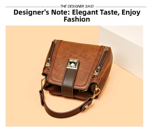 Close-up of brown pebbled leather bucket bag featuring a gray gemstone metal buckle