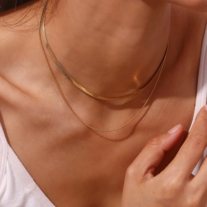 Close-up of double layered 18K gold plated stainless steel snake and cable chain necklace