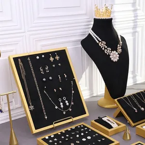 Luxury black velvet jewelry display stand set with gold and pearl necklaces and earrings