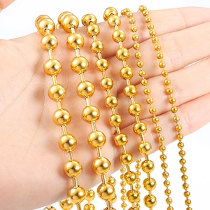 Gold vacuum-plated stainless steel bead chain in various sizes held by a hand