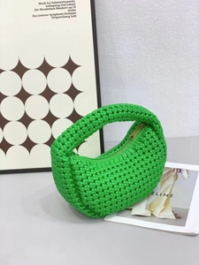 Modern neon green woven hobo bag with thick texture and crescent silhouette