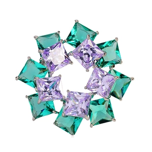 Elegant round silver brooch with alternating square green and purple zircon gemstones