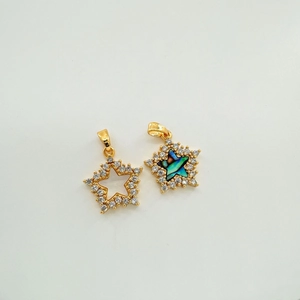 Detailed view of 18k gold plated star pendants with zircon inlay and natural mother of pearl