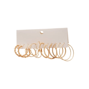 Lot de 6 paires de boucles d'oreilles créoles dorées aux textures variées sur carte