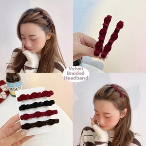 Close-up of velvet braiding hair clips in red, black and brown for elegant hair styling