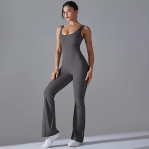 Detail of dark grey flared yoga jumpsuit showing slimming fit and high-stretch fabric texture
