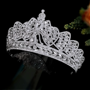 Elegant silver bridal crown with shimmering crystal bow design for luxury wedding styling