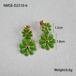 Detail showing dimensions of green daisy earrings with gold base on gray background