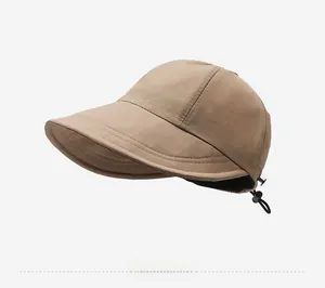 Detail of adjustable bungee cord and reinforced stitching on a khaki sun hat brim