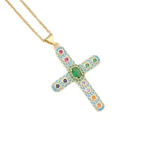 Gold cross necklace with blue enamel inlay and colorful zircon stones on white background