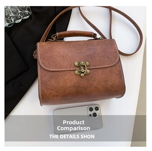 Close-up of retro brown square bag featuring detailed floral embossing and metal clasp