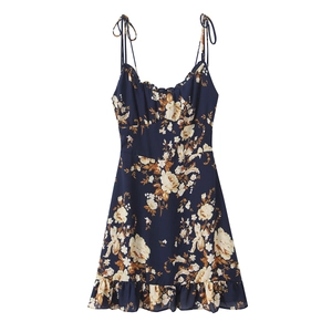 Navy blue floral strap dress with ruffle hem and slim fit silhouette on white background