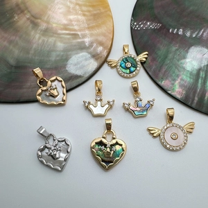 18K gold-plated shell pendants with heart, crown, and angel wing designs on shells