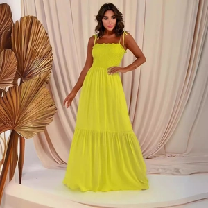 Elegant solid yellow high waist maxi dress with spaghetti straps and flowing layered hem