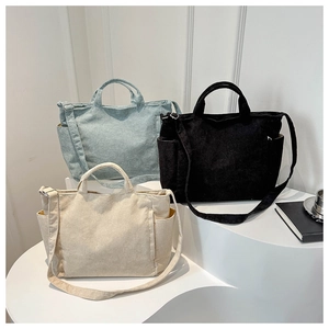 Corduroy tote bags in beige, light blue, and black with adjustable straps and side pockets
