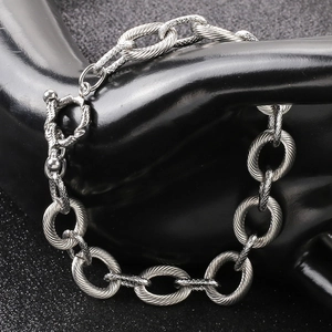 Detailed view of silver-tone textured chain bracelet with a vintage toggle clasp closure