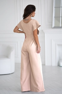 Back view of elegant beige V-neck jumpsuit featuring flutter sleeves and wide leg design