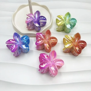 Set of 6 colorful glossy flower hair claws with gradient resin finish in a white dish