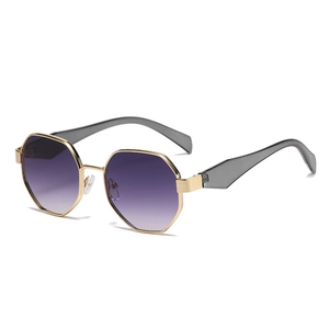 Octagonal gold metal sunglasses featuring purple gradient lenses for a modern feminine look