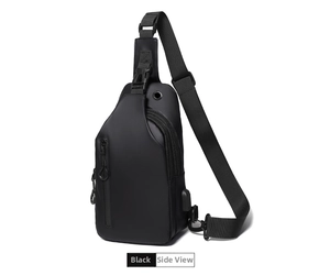 Detail view of black crossbody chest bag with USB charging port and headphone jack feature