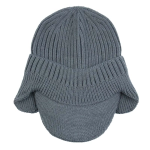 Close-up of a grey knitted winter aviator hat with ear flaps and soft textured fabric
