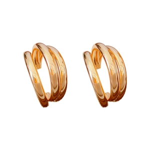 Elegant gold multi-layered C-shaped hoop earrings with minimalist irregular metal design