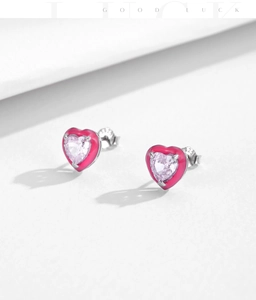 Close-up of pink heart-shaped S925 silver stud earrings with fine gemstone cut detail