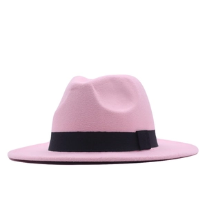 Detail showing the pink wool felt fedora with a black decorative band on white background