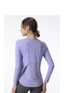 Detail view of the breathable mesh back and cutout design on this purple yoga shirt