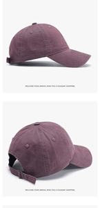 Close-up of vintage washed cotton baseball cap with letter embroidery and metal buckle