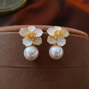 Elegant gold-tone flower earrings with sparkling crystals and a lustrous white pearl drop