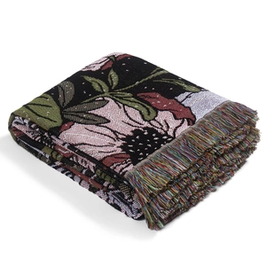 Bohemian floral woven blanket with black base and colorful fringe edges on white background